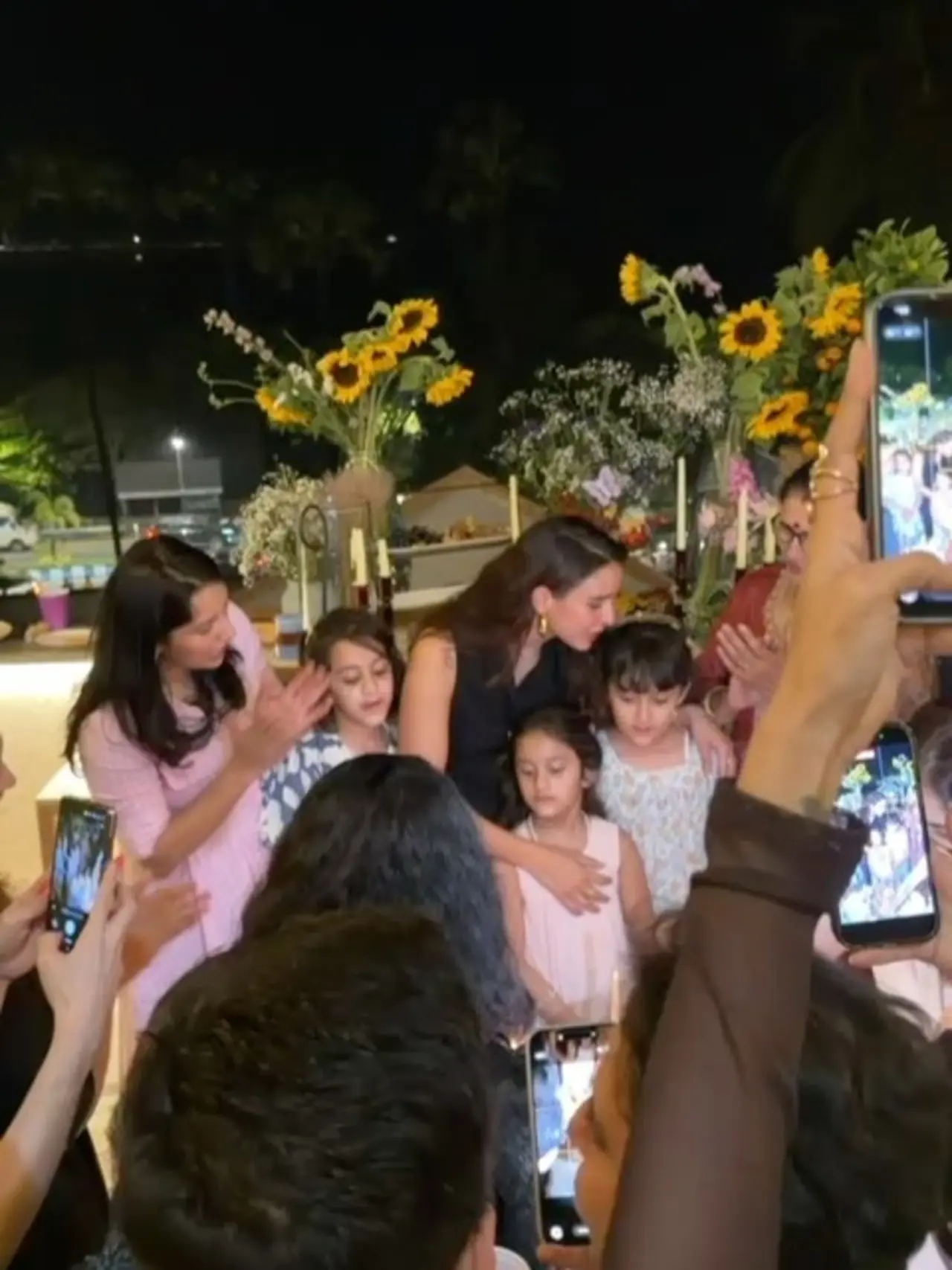 A video shared by her shows her cutting cakes surrounded by children. She was flashing her bright smile as she rejoiced the moment.